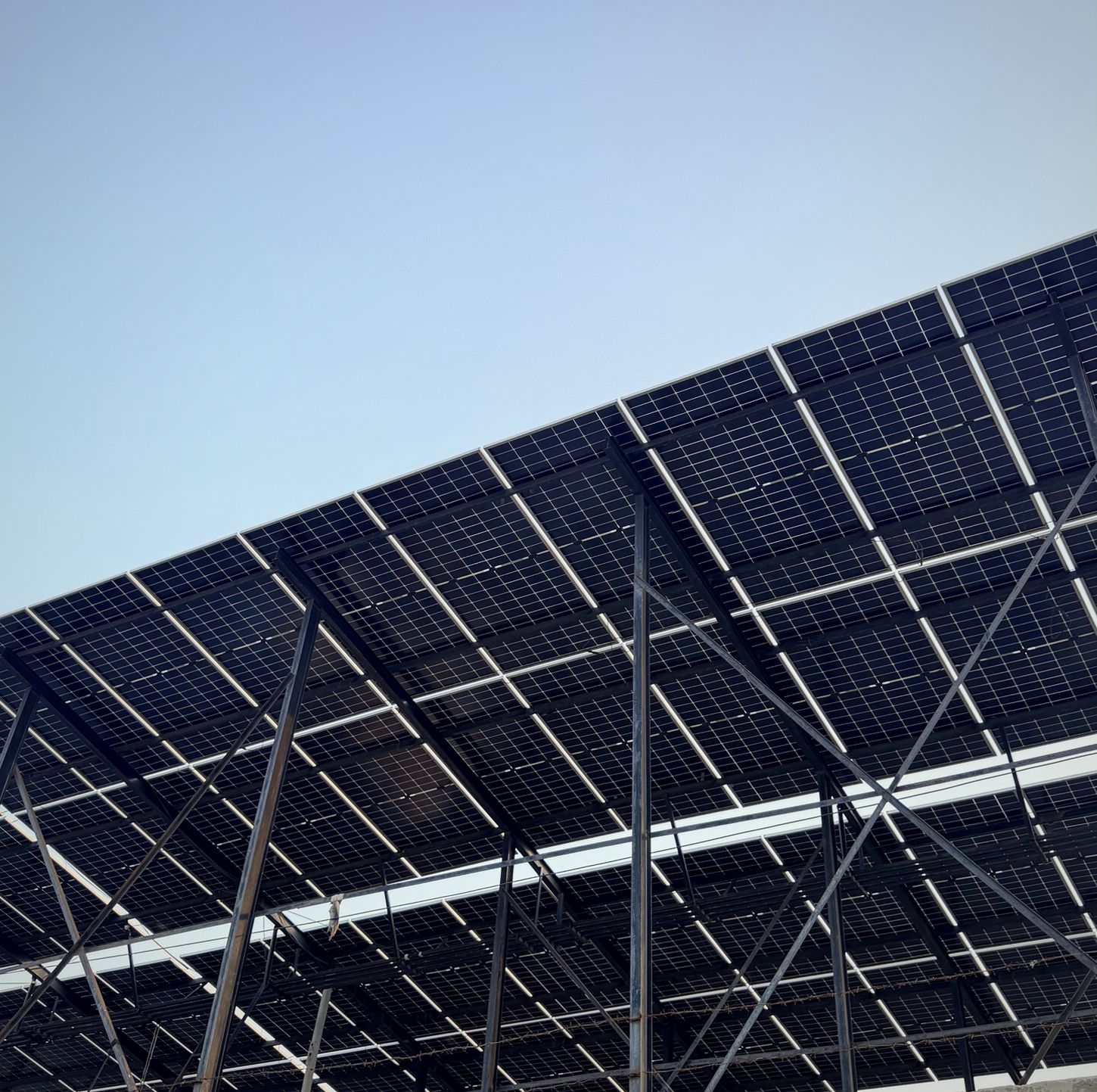 Rooftop solar panel array installed above the factory