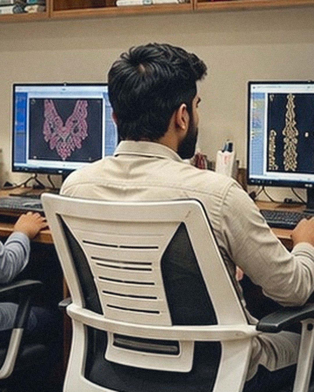 Designer sketching a neckline in the Subhan Tex design studio